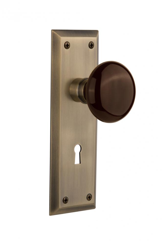Nostalgic Warehouse New York Plate with Keyhole Double Dummy Brown Porcelain Door Knob in Antique Nostalgic Warehouse New York Plate with Keyhole Double Dummy Brown Porcelain Door Knob in Antique